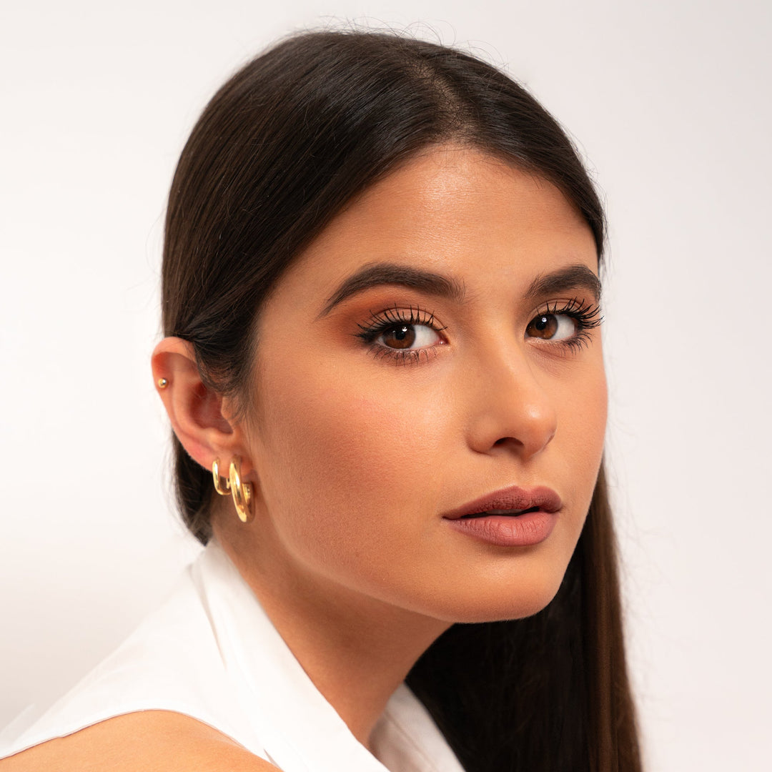 Gold plated half-round hoops for women, sleek and modern design, perfect for a subtle statement.