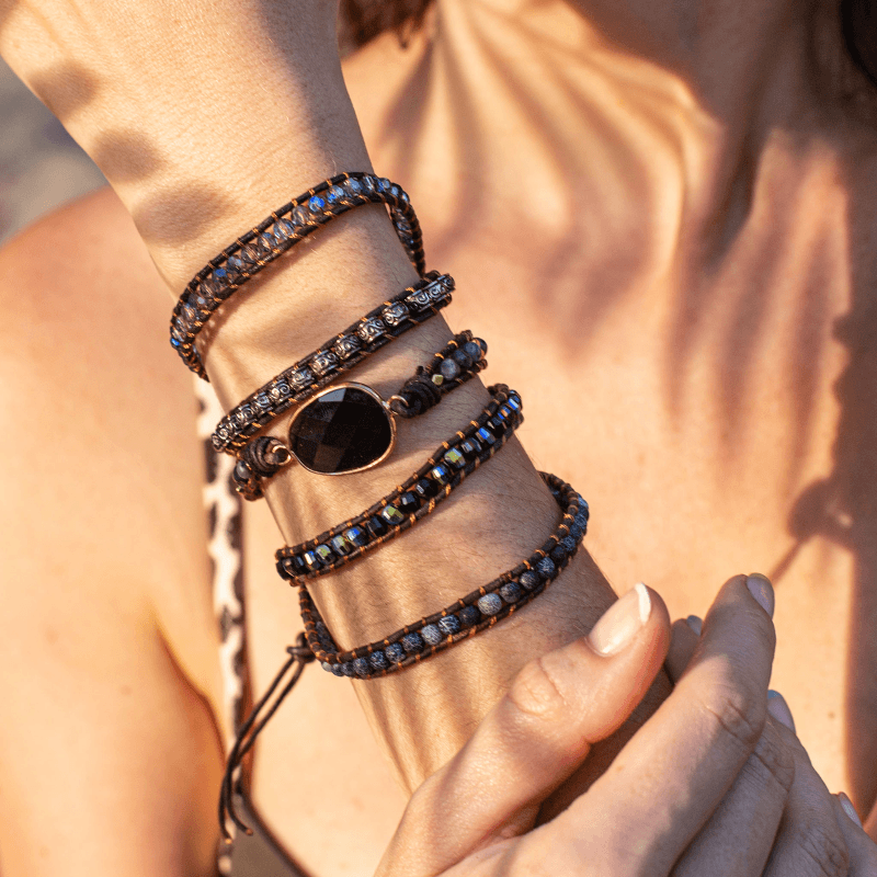 Adjustable onyx and quartz spiritual jewelry for women, a protective wrap bracelet with natural stones.