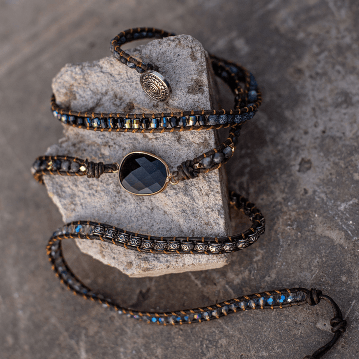 Natural onyx and quartz women's bracelet, a handmade leather wrap design featuring spiritual healing stones.