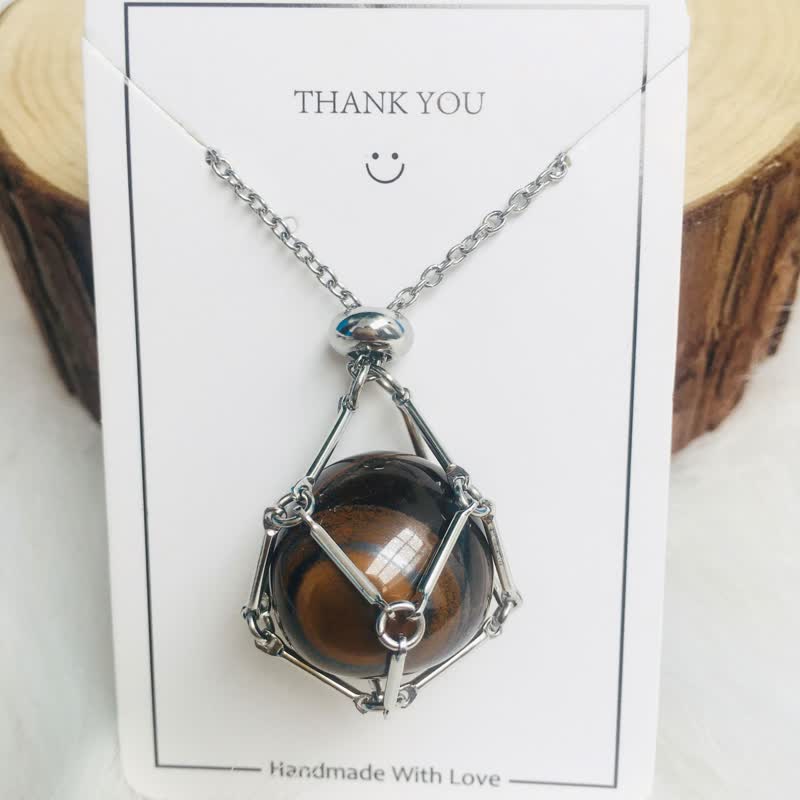 Stylish gold women's pendant with a natural healing crystal, spiritual gemstone.
