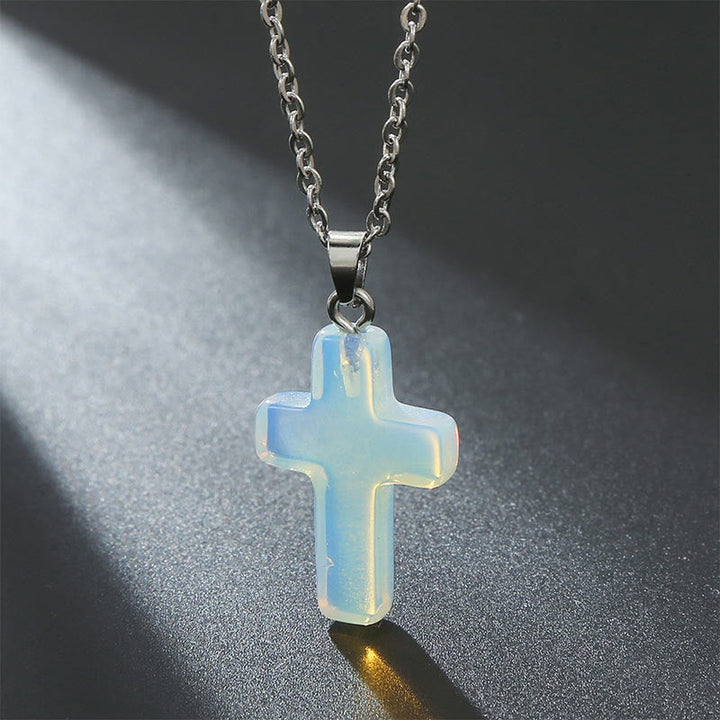 Chic natural gemstone cross pendant necklace for women, a modern spiritual accessory.
