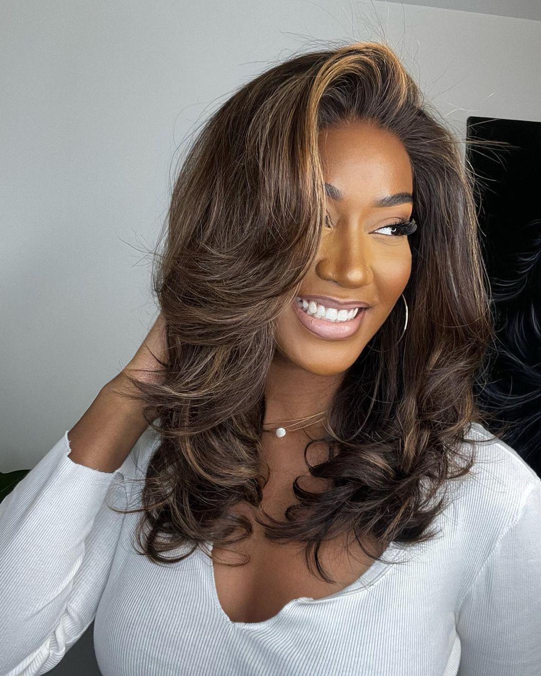 Wavy human hair lace front wig in rich brown with stunning blonde highlights, pre-plucked for natural hairline.
