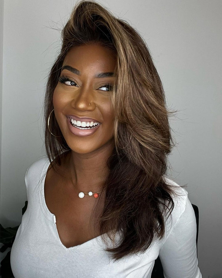Natural looking human hair lace front wig with beautiful wavy brown hair and subtle blonde highlights.