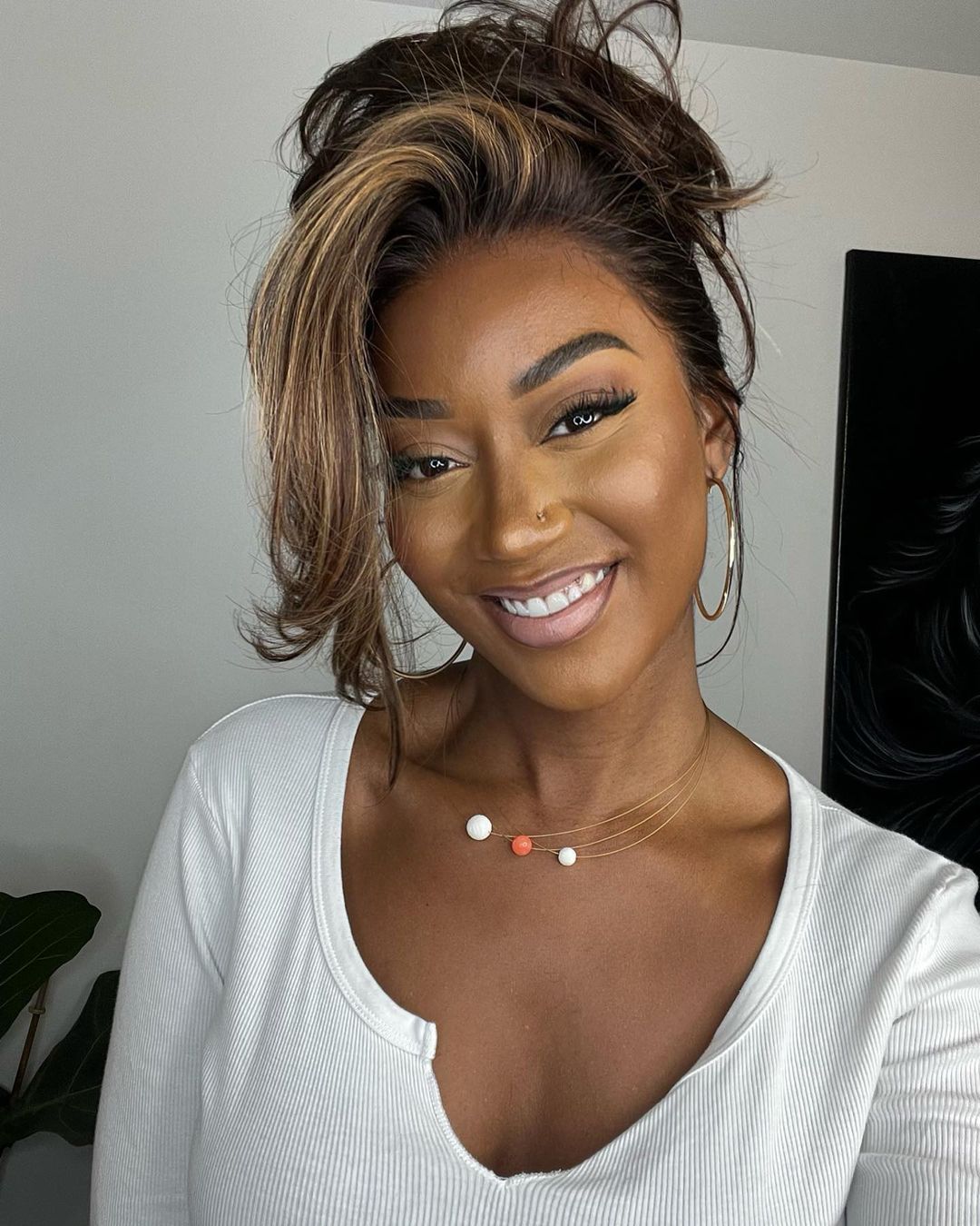Soft wavy human hair lace front wig. Natural brown base with sun-kissed blonde highlights for an authentic style.