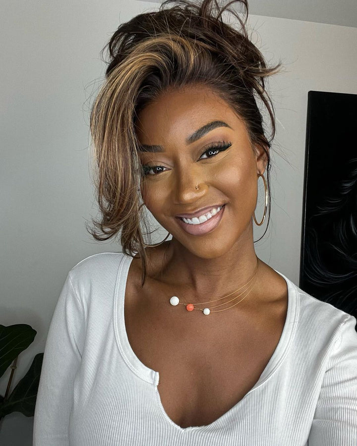 Soft wavy human hair lace front wig. Natural brown base with sun-kissed blonde highlights for an authentic style.