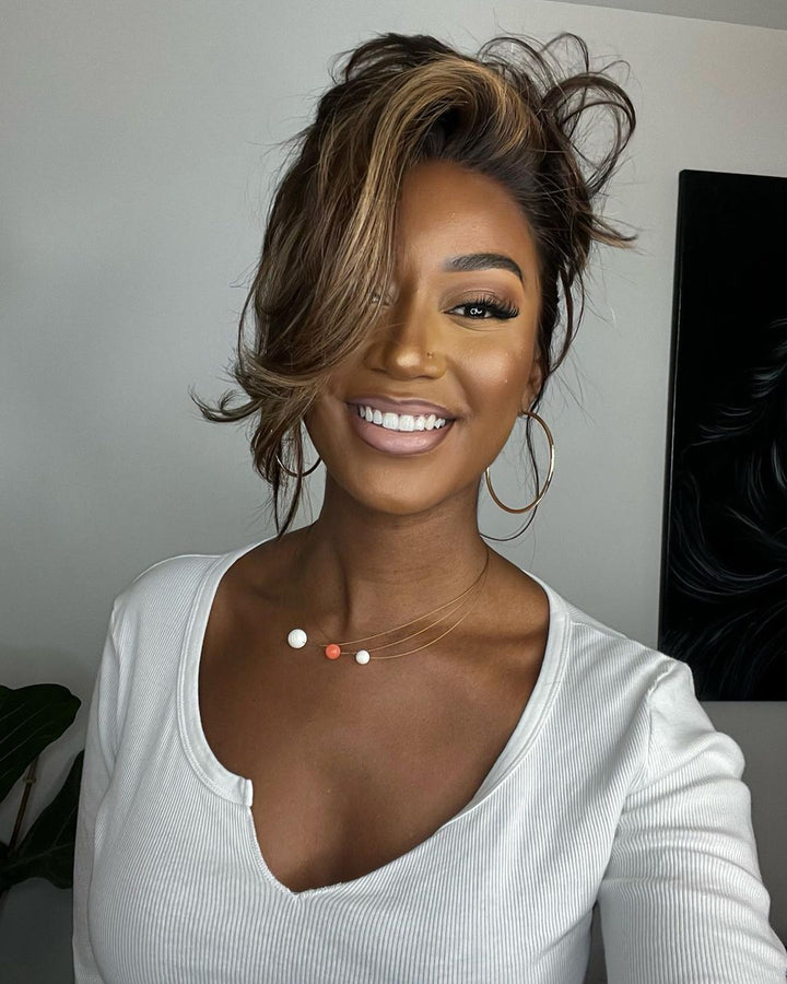 Realistic human hair lace front wig, pre-plucked for a natural hairline. Wavy brown hair with blonde highlights.