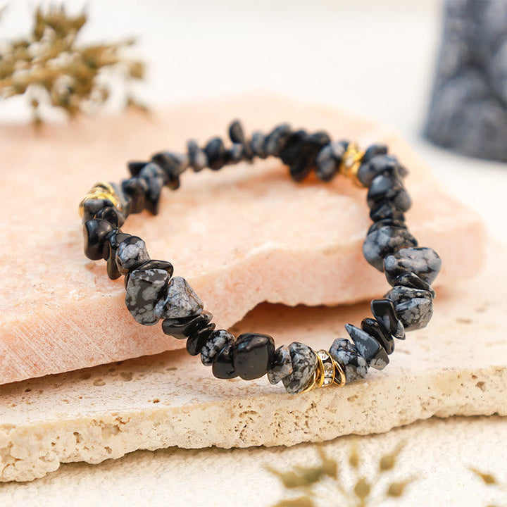 Women's gemstone bracelet with natural crystal beads. Adjustable fit.
