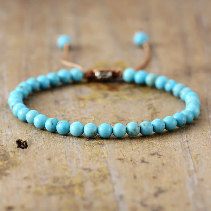 Stylish women's adjustable braided bracelet featuring natural gemstones & lustrous pearls. Fashion jewelry.