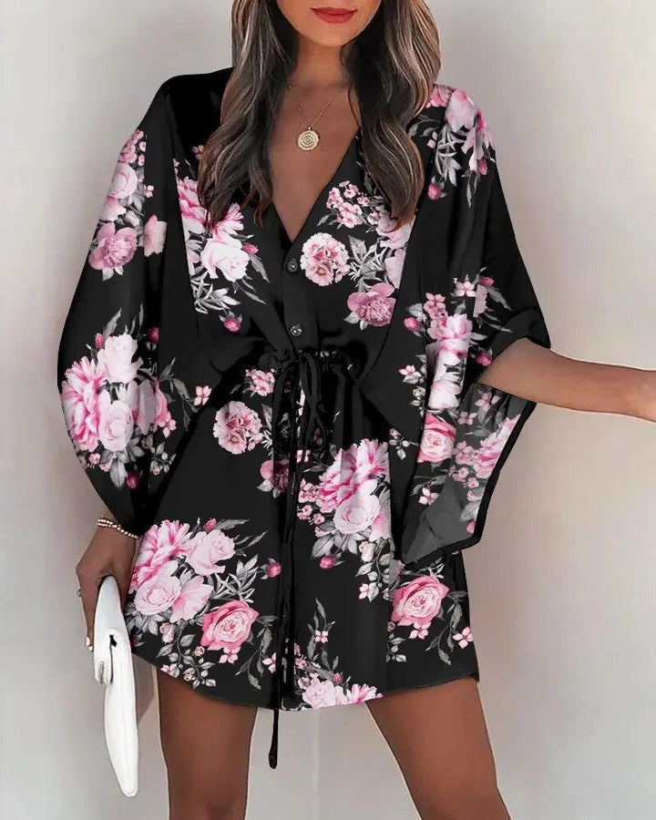 Woman wearing a casual V-neck ruffle sleeve maxi dress, perfect for summer holidays