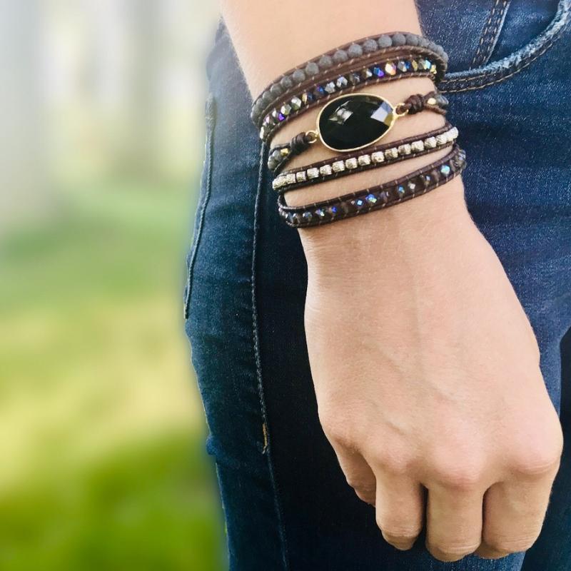 Angled shot of Onyx Moonlight Wrap Bracelet, highlighting the unique quartz and onyx bead arrangement