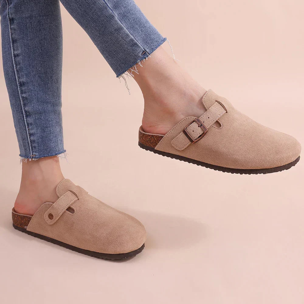 Comfortable women's slip-on house slippers with excellent arch support & pain relief. Ideal for indoor use.