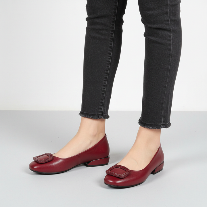 Orthopedic women's flats, black leather with a heel, providing foot pain relief and stylish everyday wear.