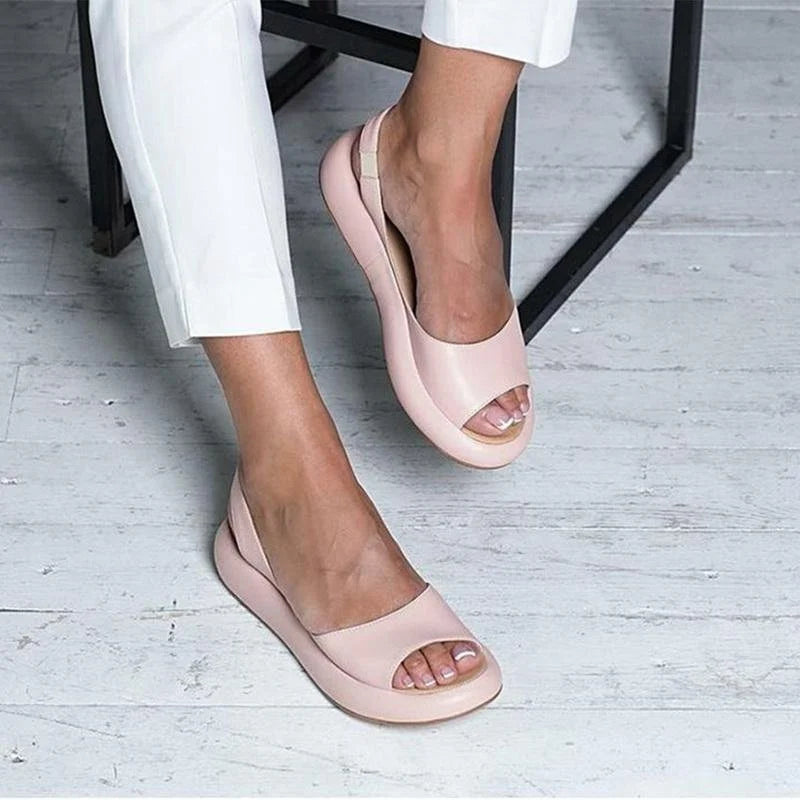 Women's orthopedic comfort sandals with low heel, arch support & cushioning for all-day wear.