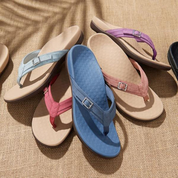 Orthopedic summer flip-flops for women, showcasing a contoured arch support design for superior foot alignment.