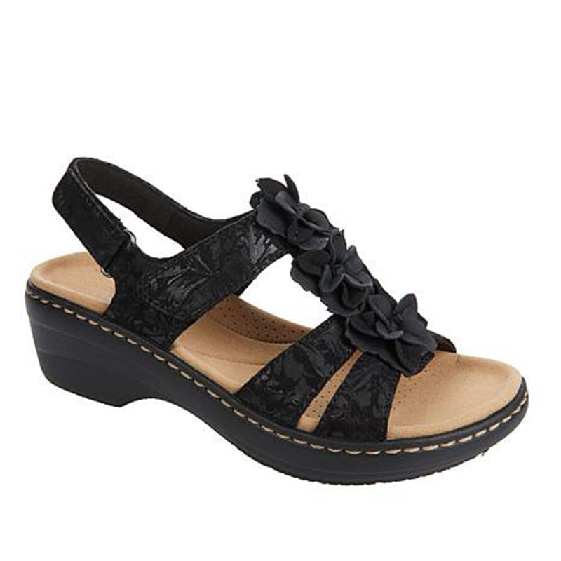 Close-up of women's floral orthopedic gladiator sandals with comfortable wedge heel
