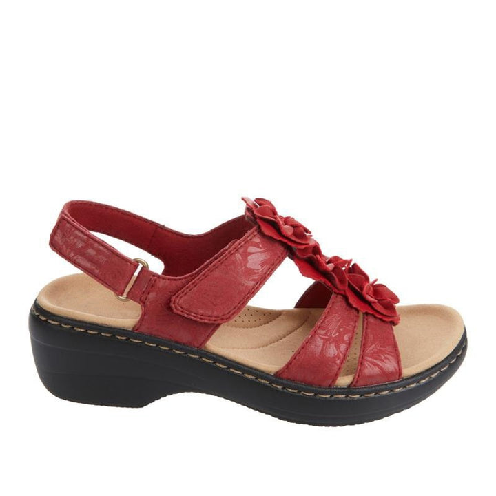 Front view of women's orthopedic gladiator sandals, floral detail, supportive wedge heel