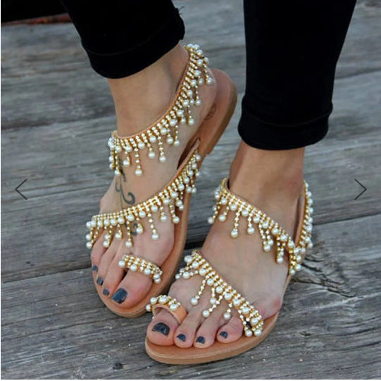 Stylish women's orthopedic flat sandals adorned with pearls. Perfect comfortable summer footwear.