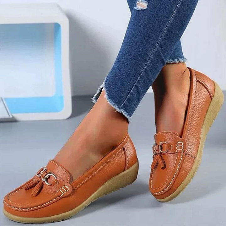 Front view: Women's orthopedic slip-on loafers. Modern design offering all-day comfort & stability for busy feet.