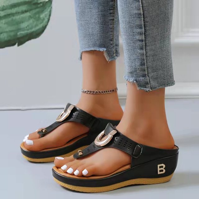 Pair of women's orthopedic sandals, ready for summer adventures, providing comfort and essential arch support.