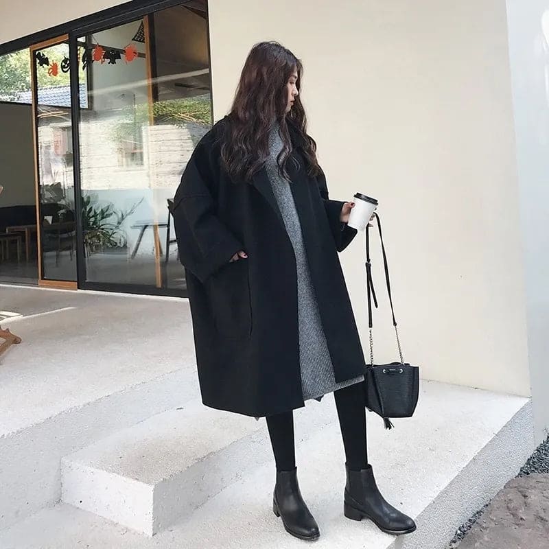 Elegant women's long trench coat, an oversized classic double-breasted outerwear staple for formal and chic style.