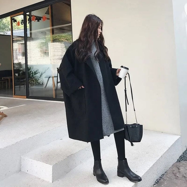 Elegant women's long trench coat, an oversized classic double-breasted outerwear staple for formal and chic style.