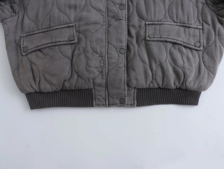 Versatile women's gray oversized bomber jacket, essential outerwear for a chic casual wardrobe.