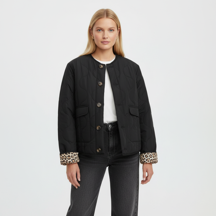 Fashionable women's quilted jacket with a vivid leopard print interior, perfect for casual outerwear.