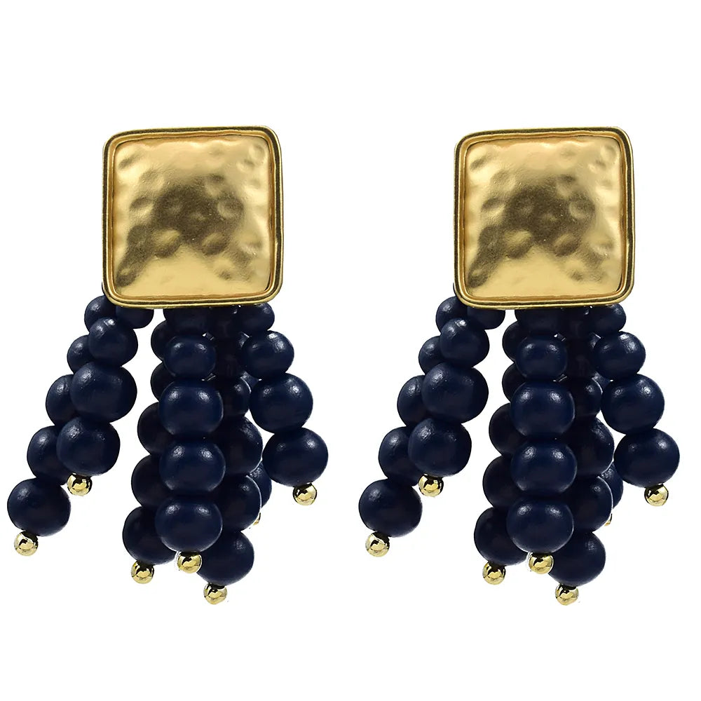 Women's pearl-shaped wooden chain drop earrings. Unique handmade natural jewelry for boho fashion.