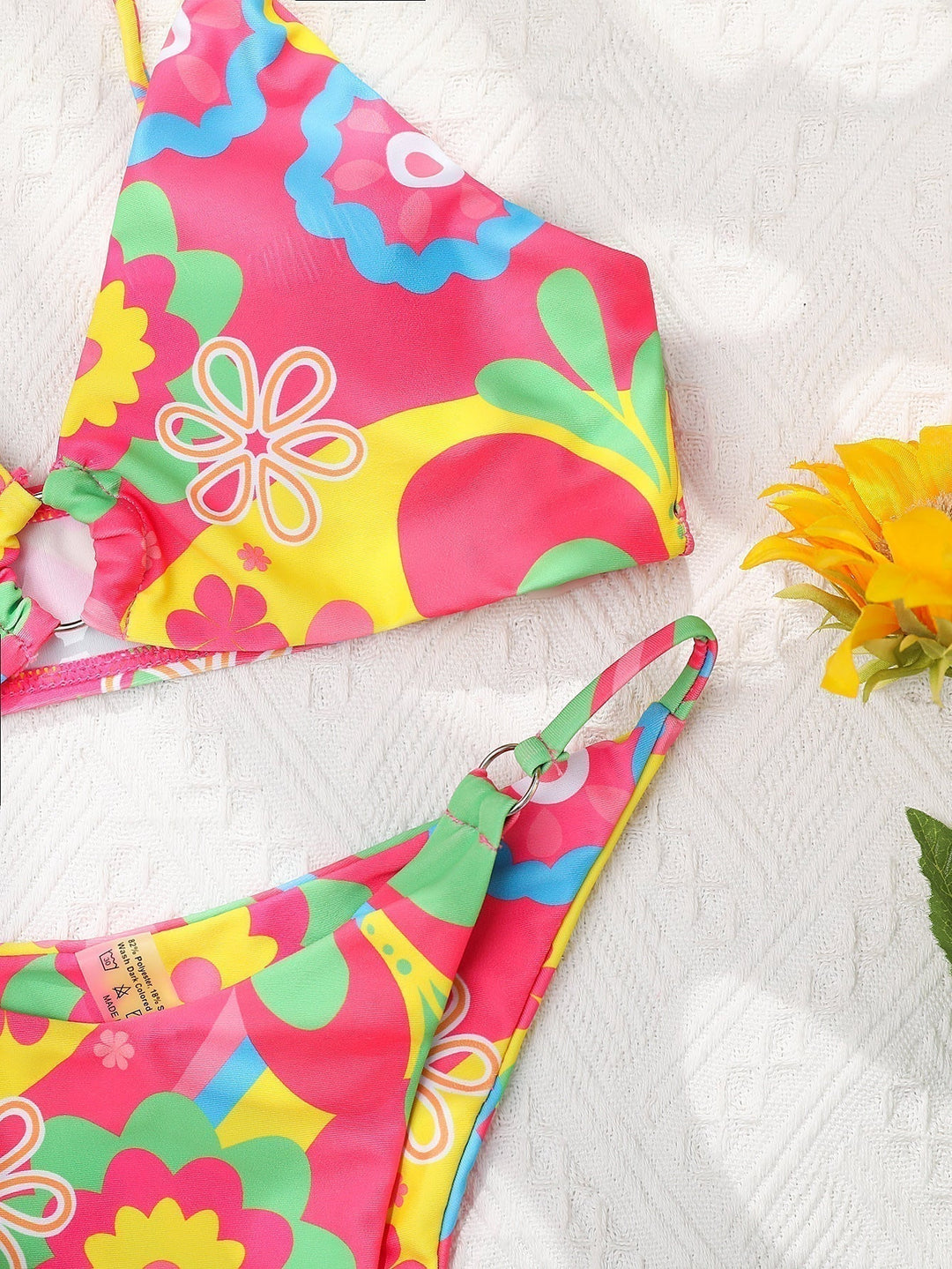 Elegant women's pink floral bikini set with flattering fit, perfect vacation outfit for tropical getaways.