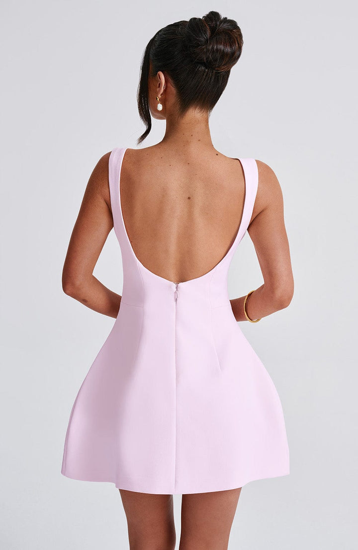 Elegant pink halter neck mini dress for women, sleeveless and perfect as a summer party dress or vacation wear.