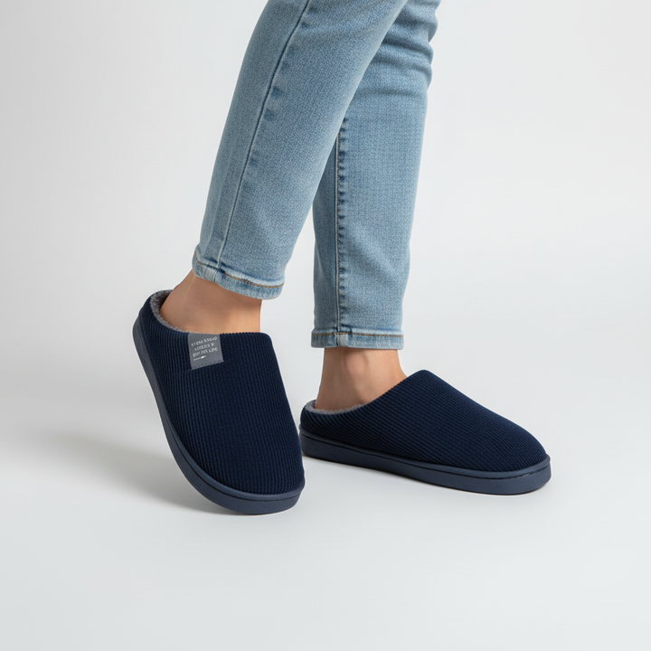 Soft green women's non-slip ribbed house slippers, designed for warmth and indoor safety.