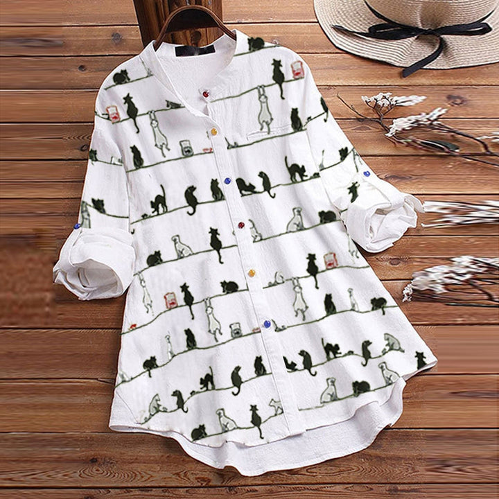 Stylish women's long sleeve button-down blouse with a cute cat print, offering everyday comfort.