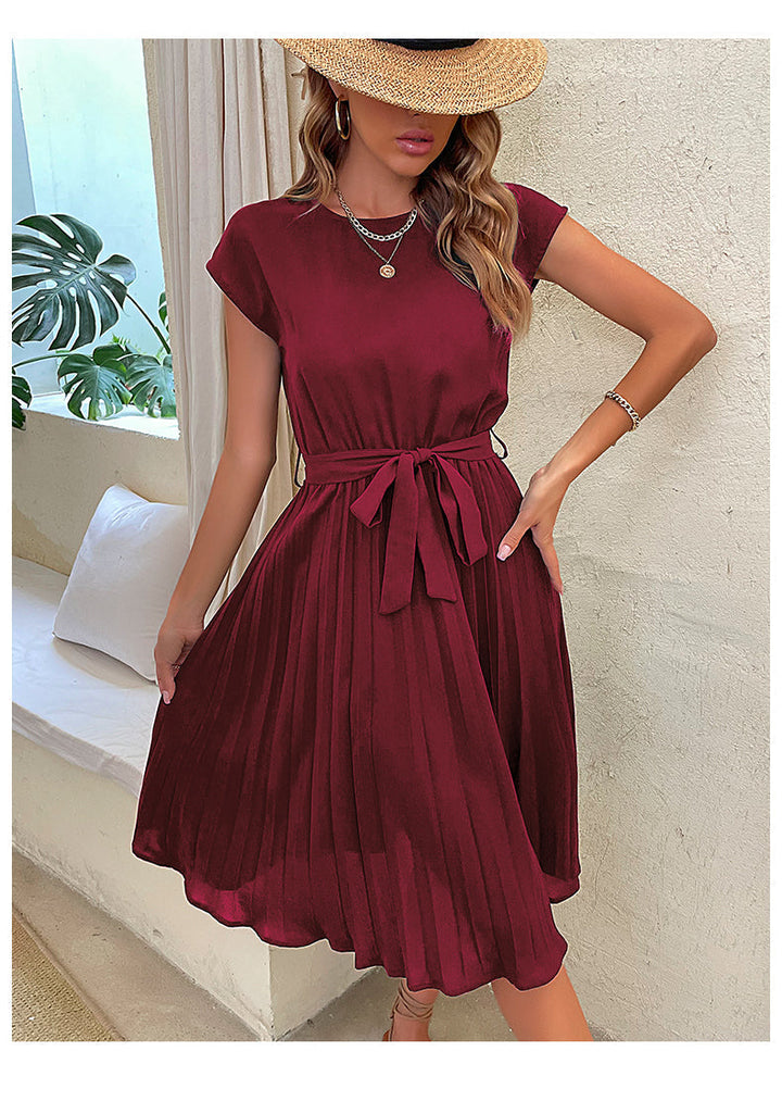 Women's pleated A-line summer dress with short sleeves, perfect for casual or office wear. Comfortable and feminine.