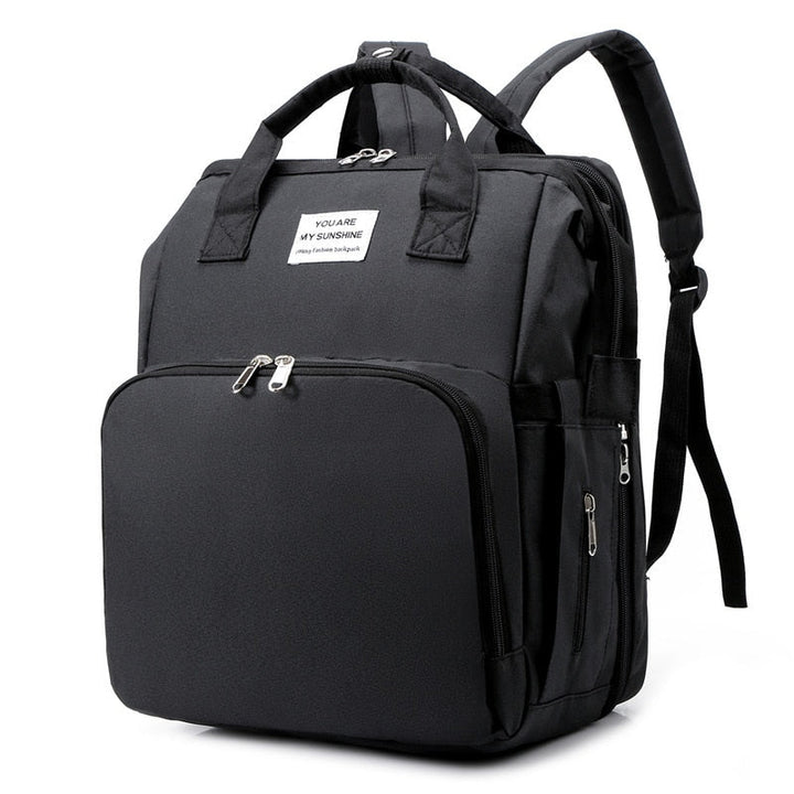 Women's portable baby bed & diaper bag travel backpack, multi-function for infant care.