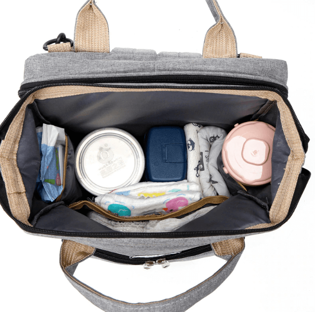 Sleek multi-function portable baby bed & diaper bag backpack for contemporary parents.