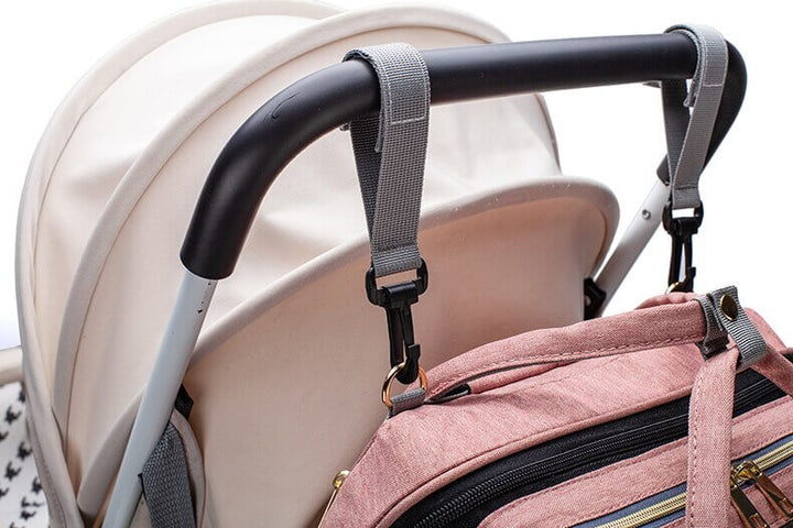 Compact baby travel backpack with fold-out portable bed for easy infant care anywhere.