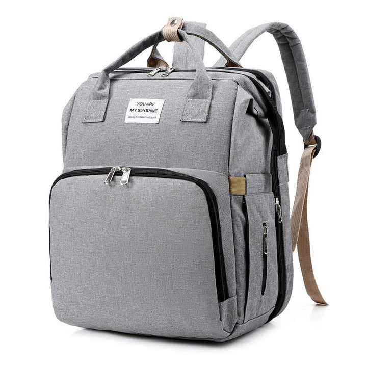 Stylish multi-function diaper bag backpack for women, perfect for baby travel essentials.