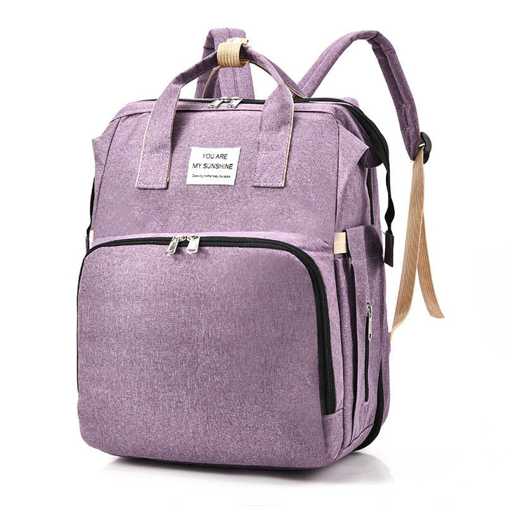 Durable nylon baby backpack & portable bed, ideal travel gear for busy parents on the go.