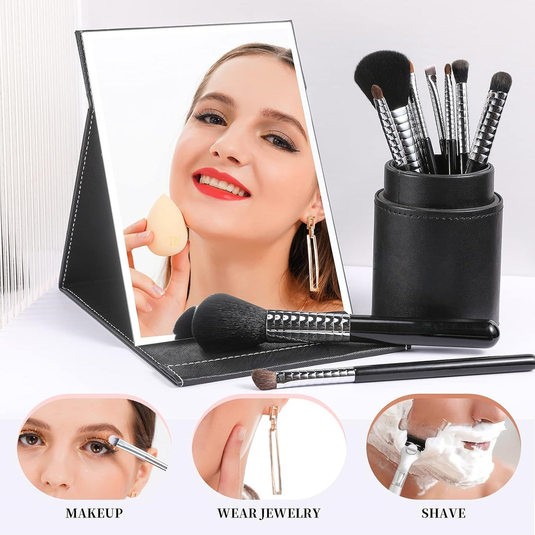 Women's compact mirror with adjustable stand, ideal for applying makeup anywhere, a travel essential.