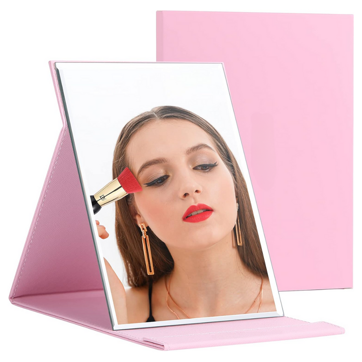 Portable compact makeup mirror for women with adjustable stand, ideal travel beauty essential.