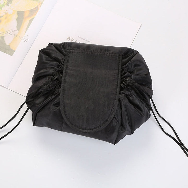 Drawstring makeup travel organizer in grey flamingo. Keeps women's toiletries neat & accessible.