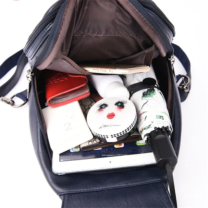 User carrying a women's water-resistant leather backpack, highlighting its comfortable fit.