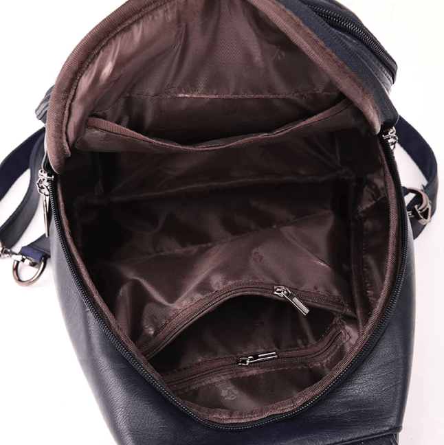Women's leather backpack in a professional setting, suitable for both work and travel.