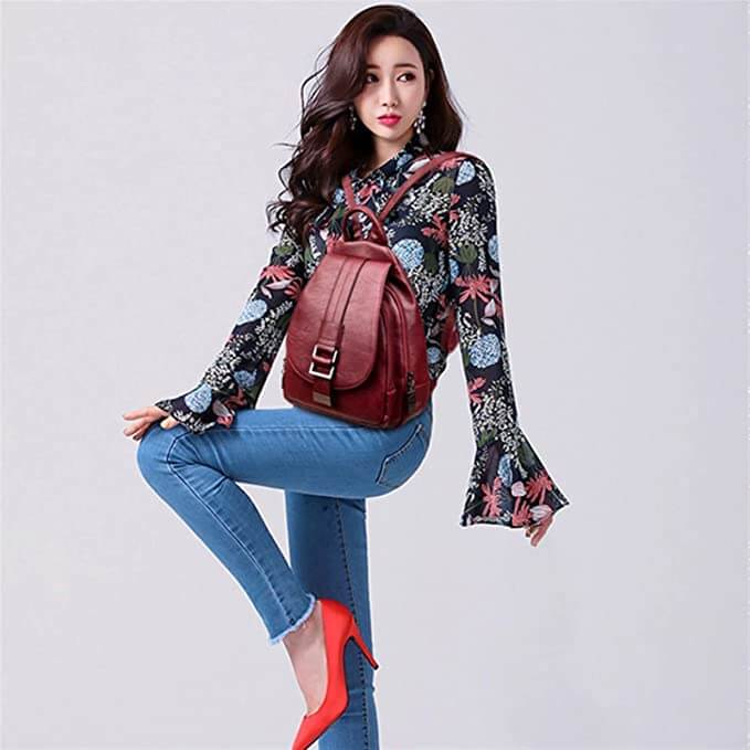 Unpacked women's premium water-resistant leather backpack, showing its capacity and versatility.