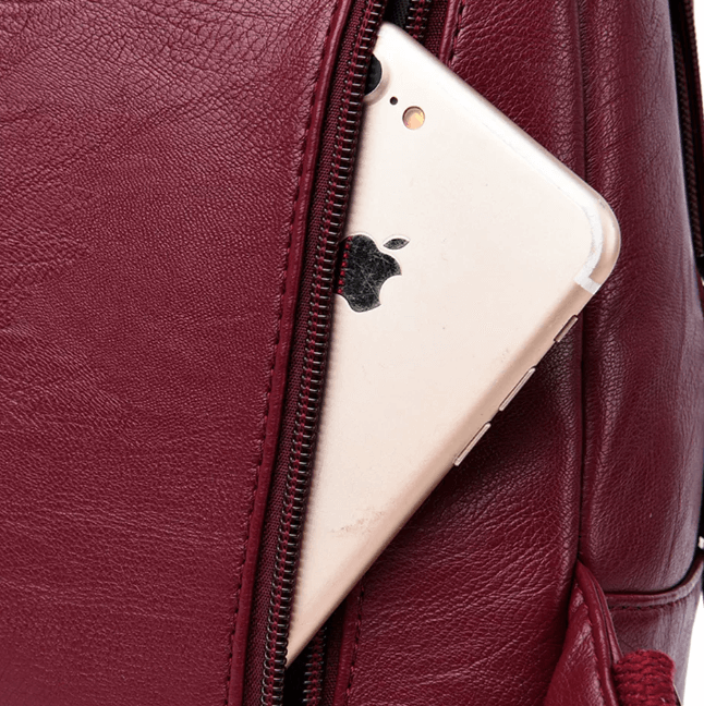 Back view of a women's premium water-resistant leather backpack with comfortable shoulder straps.