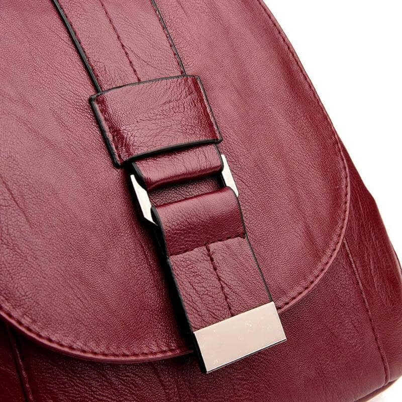 Women's anti-theft leather backpack in rain, demonstrating its water-resistant quality.