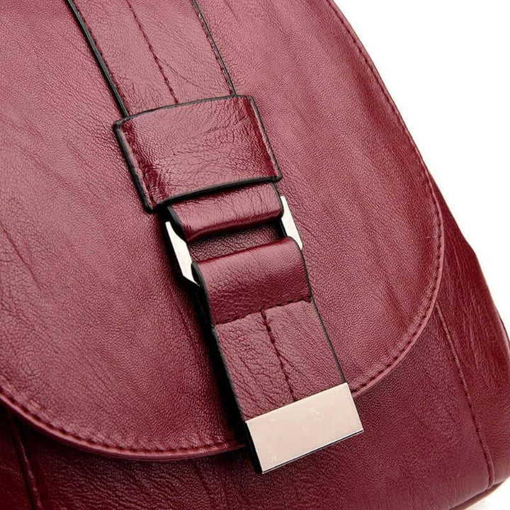 Women's anti-theft leather backpack in rain, demonstrating its water-resistant quality.