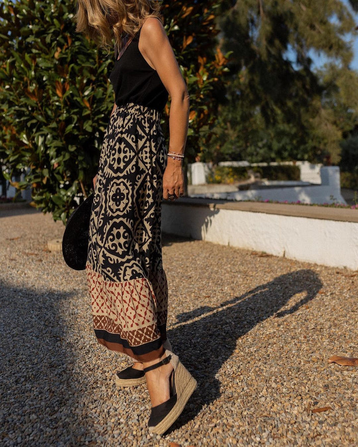Boho chic women's skirt, printed, maxi length, and beautiful flowing fringe detail.