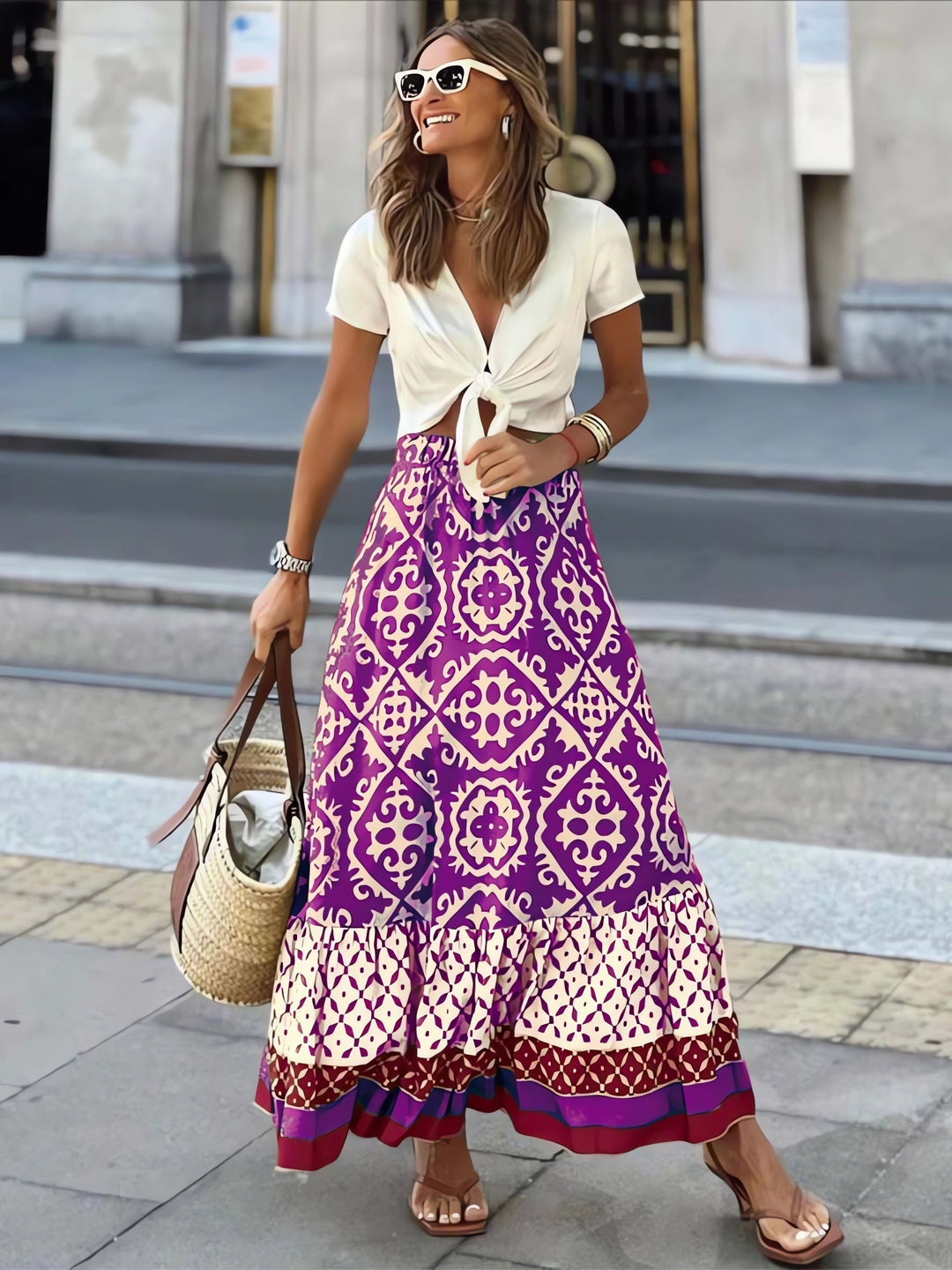 Women's flowing printed boho maxi skirt with stylish fringes for summer fashion.