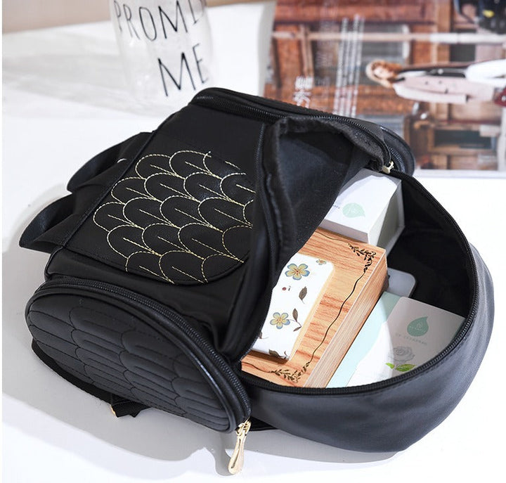 PU leather shoulder bag for women, adorned with an owl print and multiple compartments